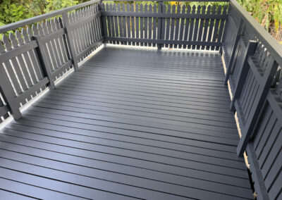 Freshly painted charcoal timber deck and balustrade.